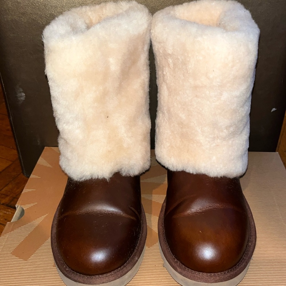 Gently used Ugg boots. Size 8 .  Leather with shearling fur on the outside